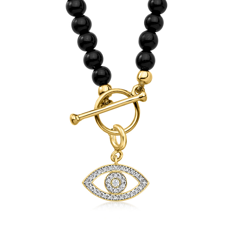 Onyx bead toggle necklace detail: eye charm with gold-tone toggle clasp