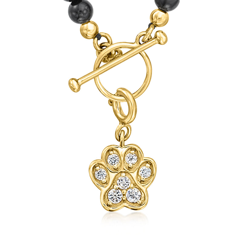 Paw print charm pendant with gold bar and black bead necklace
