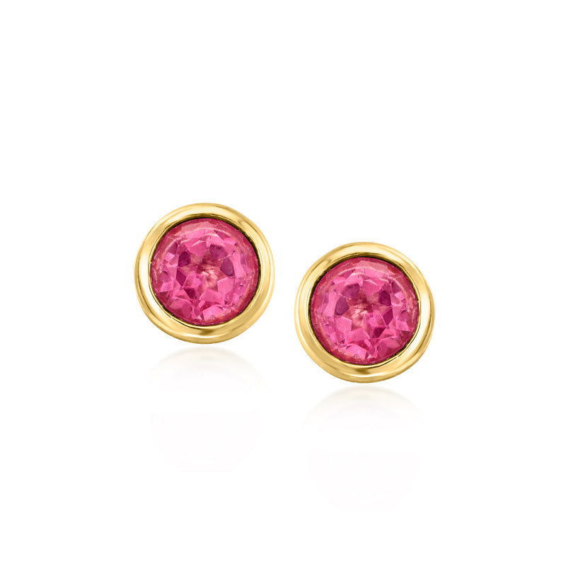 Gold-tone round stud earrings with a pink gemstone center