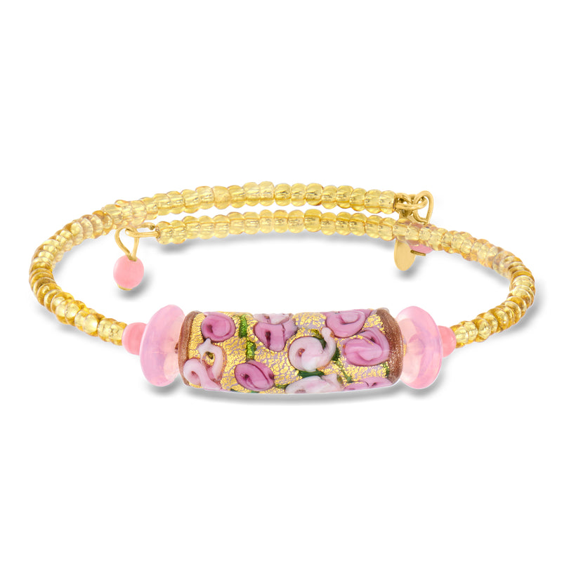 Gold-tone wrap bracelet with pink floral Murano-style bead centerpiece and round charm drops