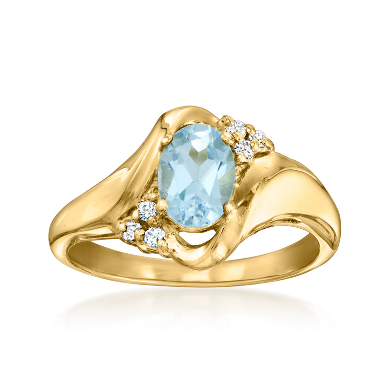 Vintage 14k yellow gold ring with oval sky blue topaz and small diamond accents