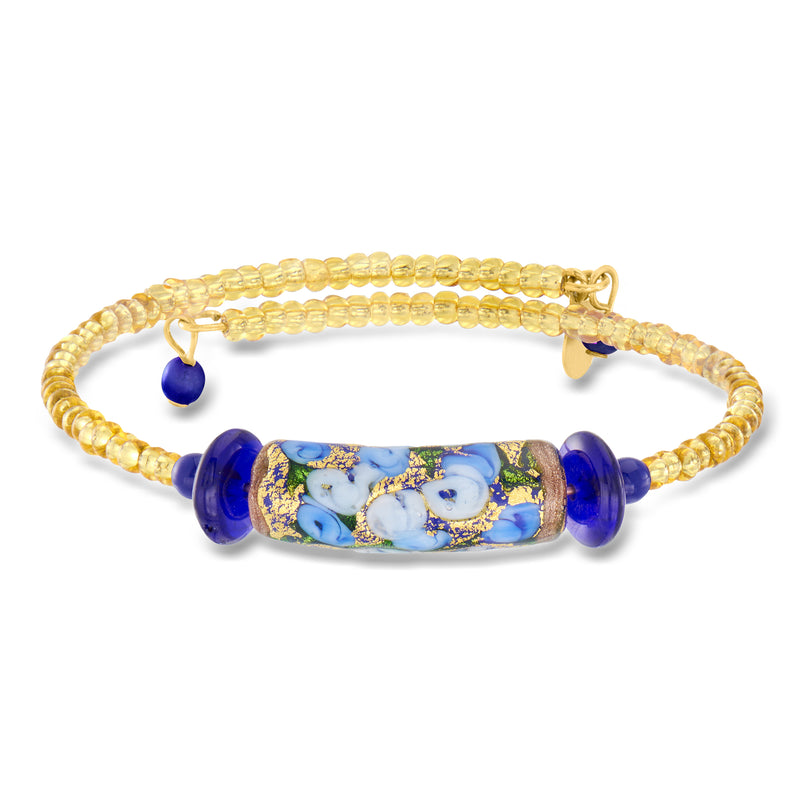 Gold bead wrap bracelet with blue floral glass center and navy accent beads
