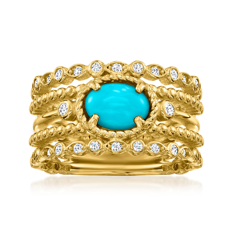 Gold ring with oval turquoise centerpiece and round white stones on textured band