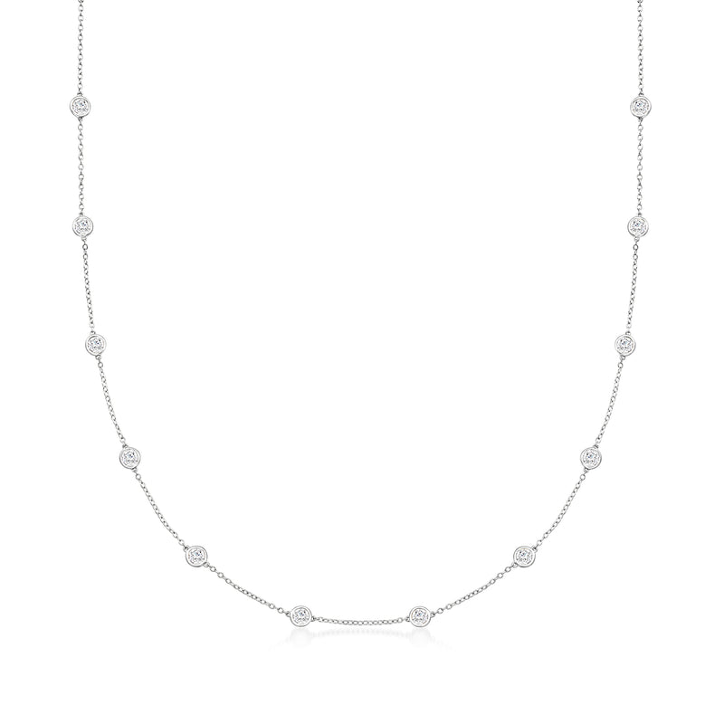 White gold diamond station necklace with round bezel-set stones on linked chain