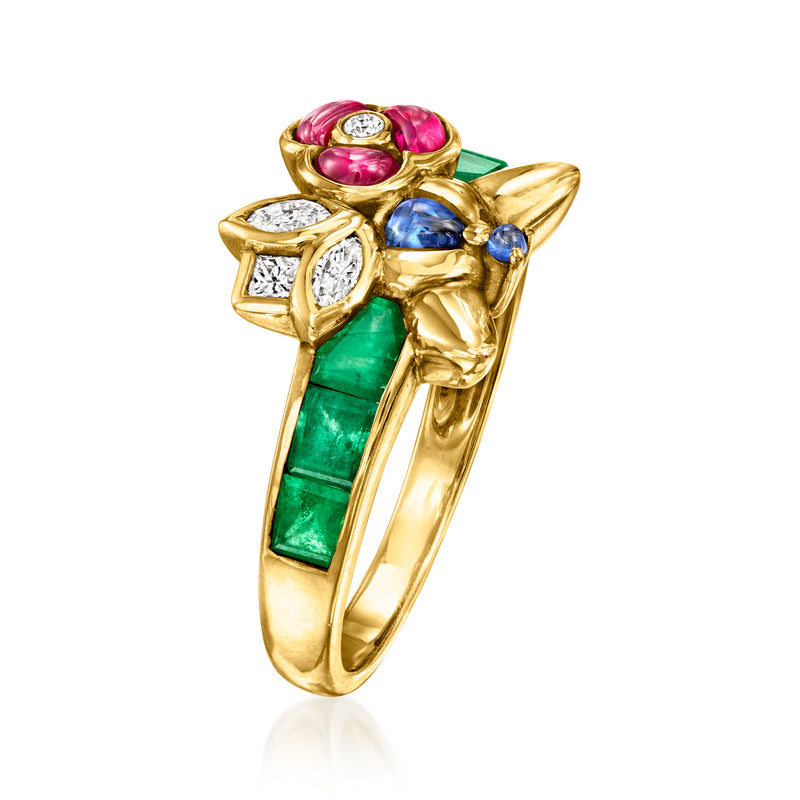 Gold flower ring with green rectangular gemstone, blue stones, pink oval stones, and diamond petals