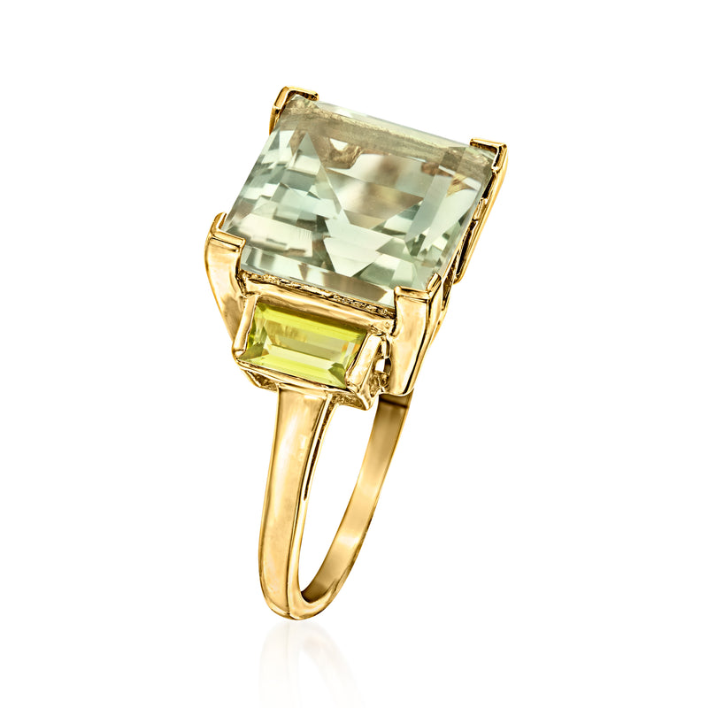 Square pale green gemstone ring with gold tone bezel and yellow-green side stones