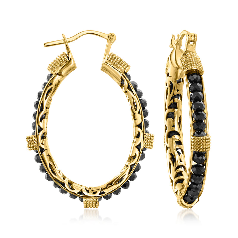 Gold hoop earrings with black beaded bands and scalloped texture