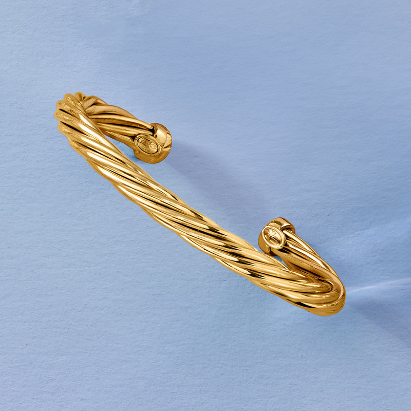 Twisted cuff bracelet with gold knot end caps and ridged wire design