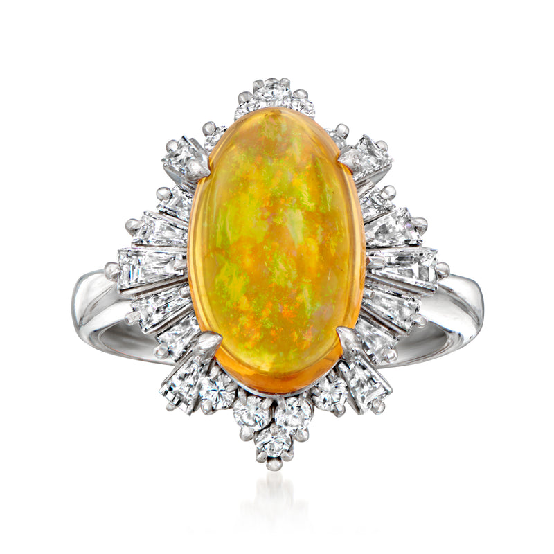 Platinum opal and diamond ring with oval yellow-orange opal center and halo of baguette diamonds.