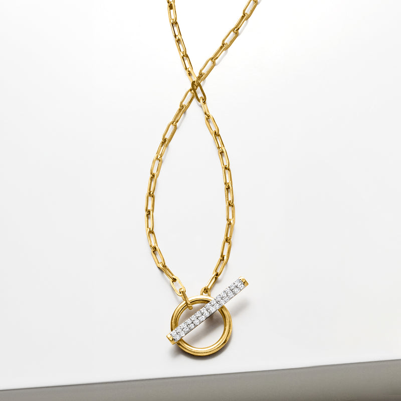 Gold paper-clip link toggle necklace with oval ring and diamond bar