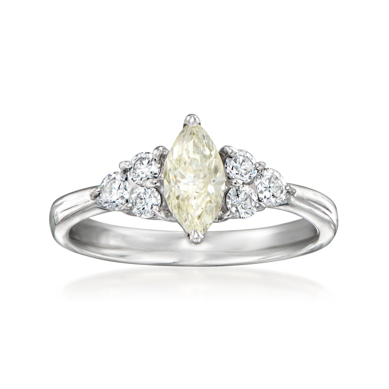 Vintage platinum diamond ring with pear-shaped yellow center and side halo