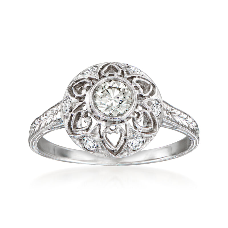 14kt white gold diamond filigree ring with round center stone and halo