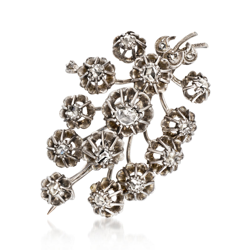 Sterling silver diamond flower pin with clustered round stones, side view
