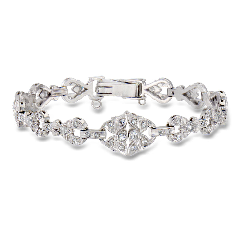 Platinum diamond tennis bracelet with heart-shaped and round brilliant stones