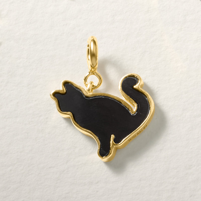 Black onyx cat charm with gold-tone loop bail and raised cat outline
