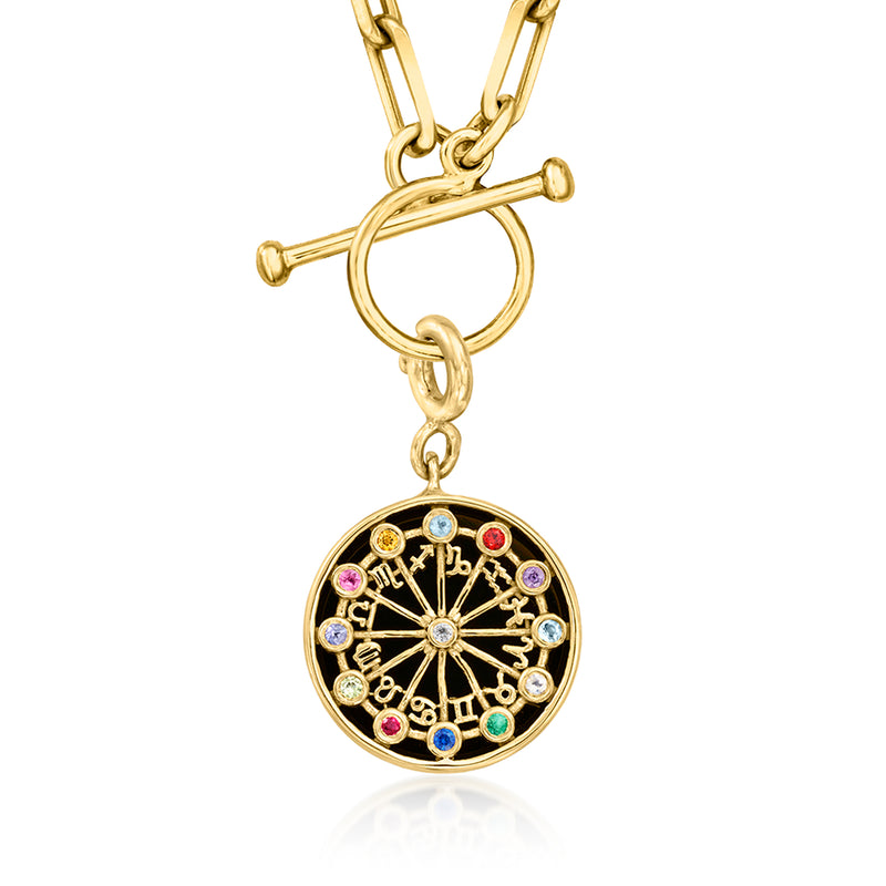 Gold-tone round zodiac wheel charm with multicolored gemstones and black enamel center