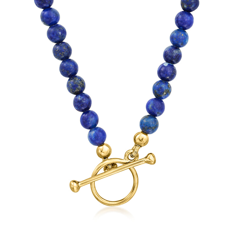 Lapis blue bead necklace with gold toggle clasp and eye-shaped charm pendant