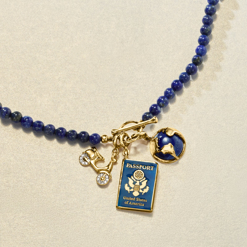 Lapis blue bead charm necklace with gold charms, including passport tag