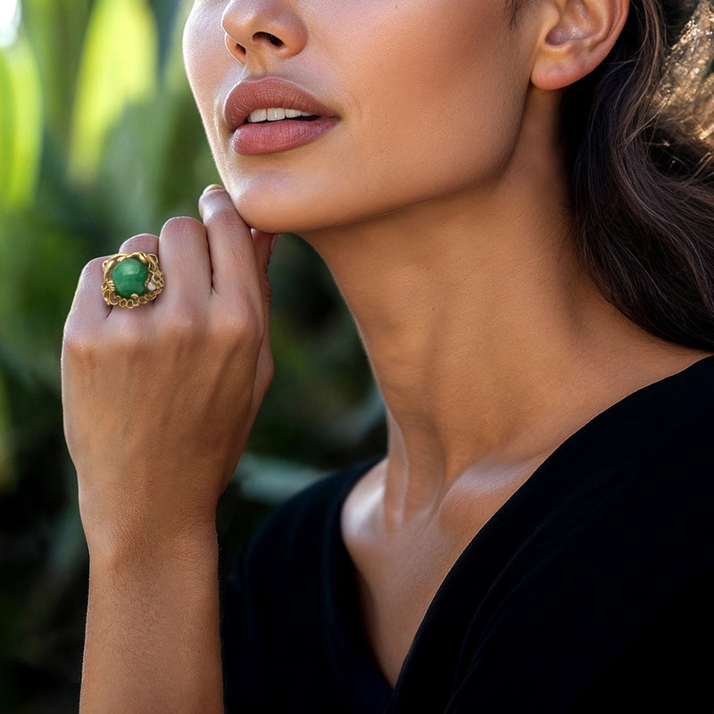 Green jade dragon ring with pearl accents on finger in 14kt yellow gold