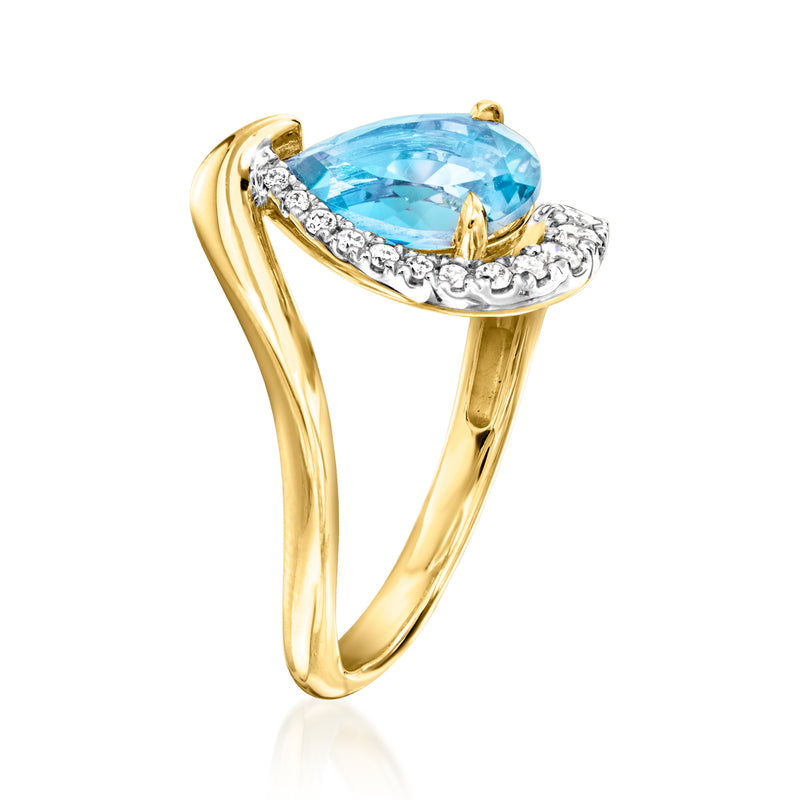 Gold over sterling ring with pear blue topaz and diamond-accented curved setting