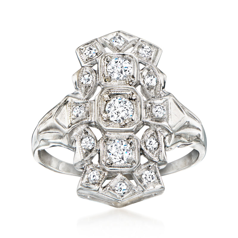 Vintage diamond dinner ring in 14kt white gold with octagonal halo and central round stone