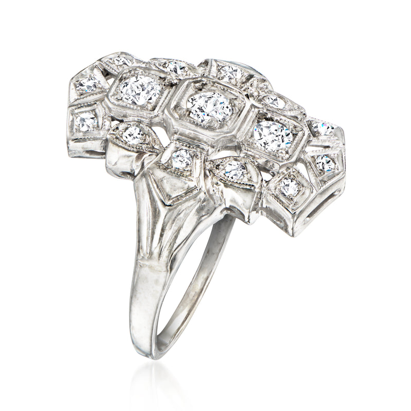 Vintage diamond dinner ring with square step settings, central round diamond, white gold