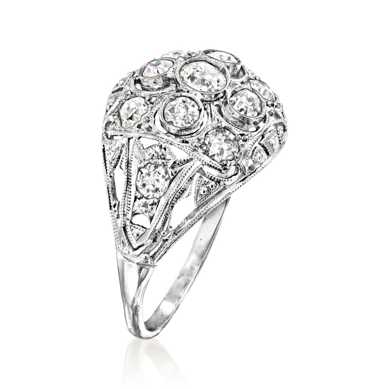 Diamond filigree ring side view with openwork gallery and oval center stones