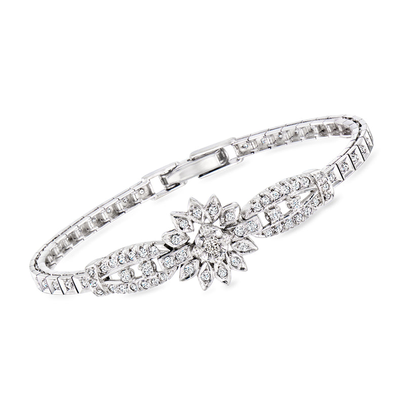 Diamond floral bracelet in 14kt white gold with clear stones, hinged tennis style