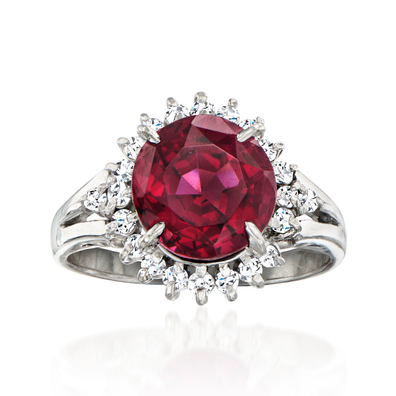 Platinum vintage style ring with large deep red rhodolite garnet and white diamond halo