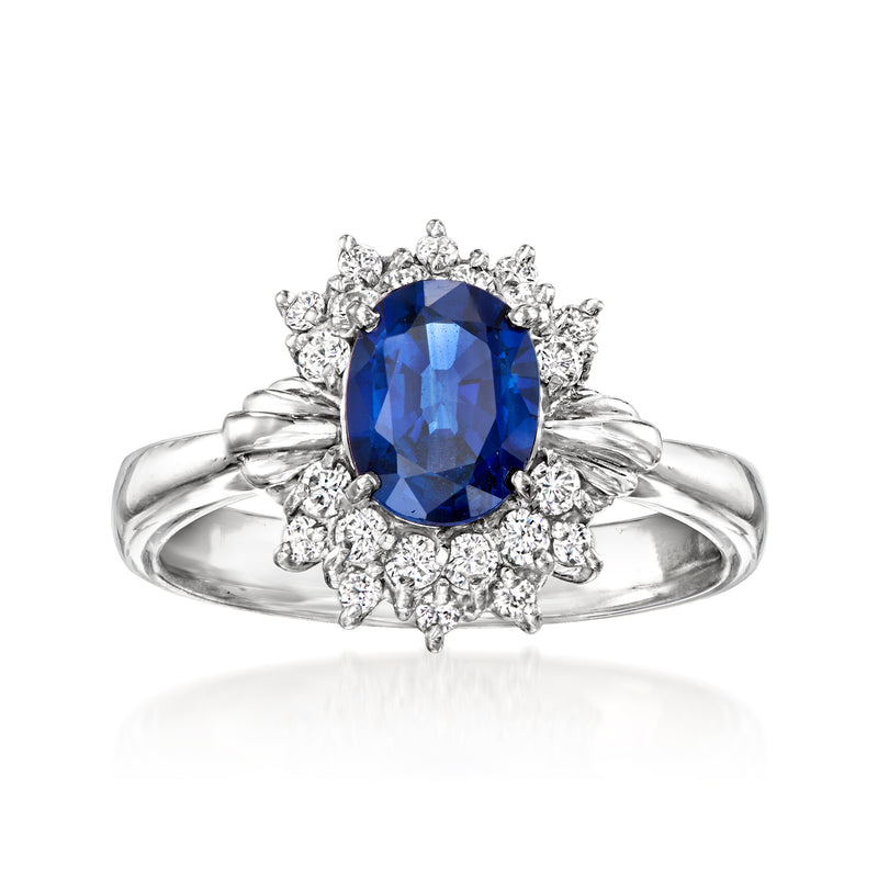 Platinum oval sapphire ring with diamond halo and split shank