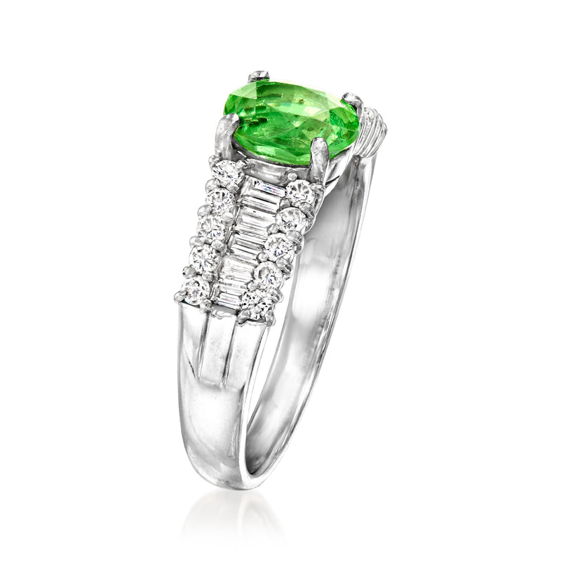 Platinum ring with oval green tsavorite center and baguette diamond side accents