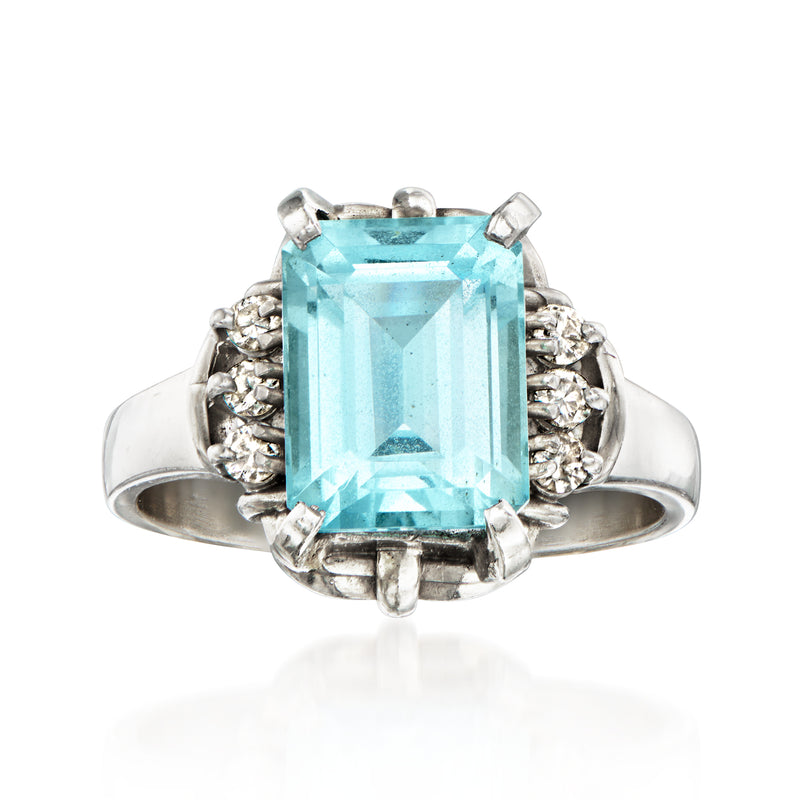 Platinum vintage ring with rectangular aquamarine center and diamond halo