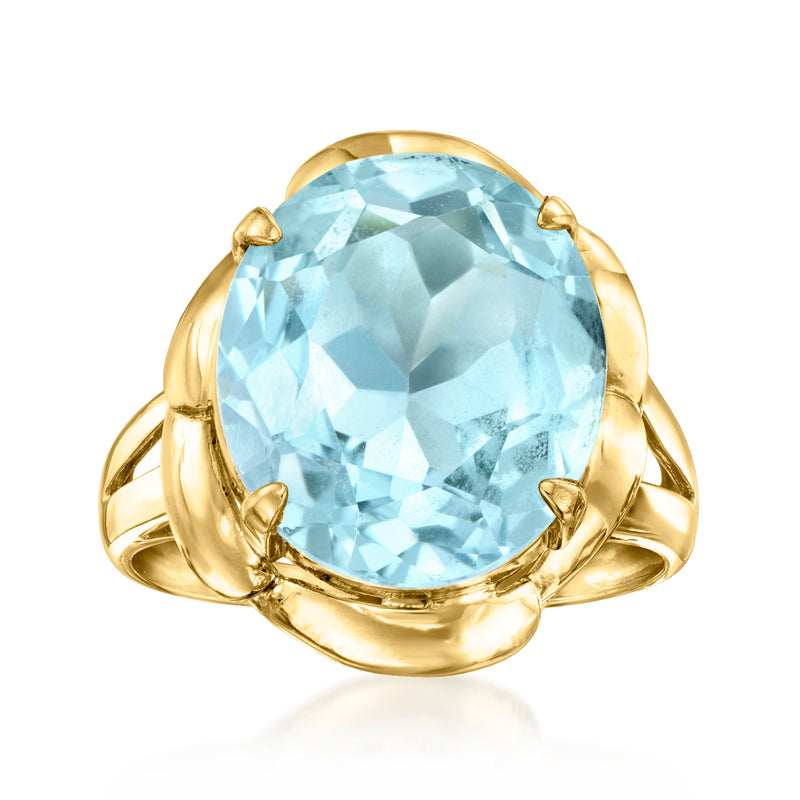 Oval sky blue topaz ring in 18kt yellow gold with four-prong setting
