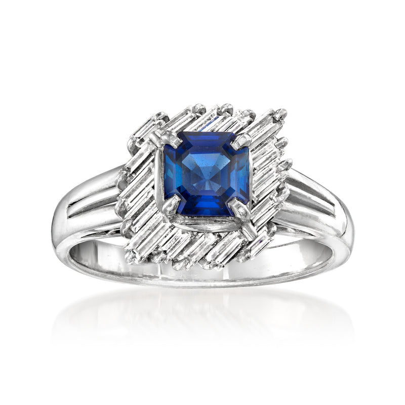Platinum halo ring with blue center sapphire and baguette diamond side stones