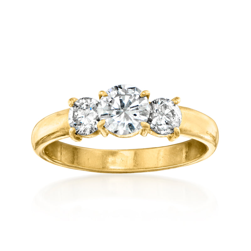 18kt yellow gold three-stone diamond ring with round center and side stones