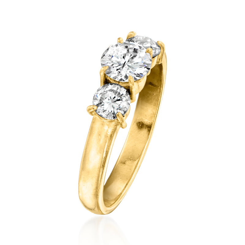 Yellow gold three-stone diamond ring, round stones in a prong setting