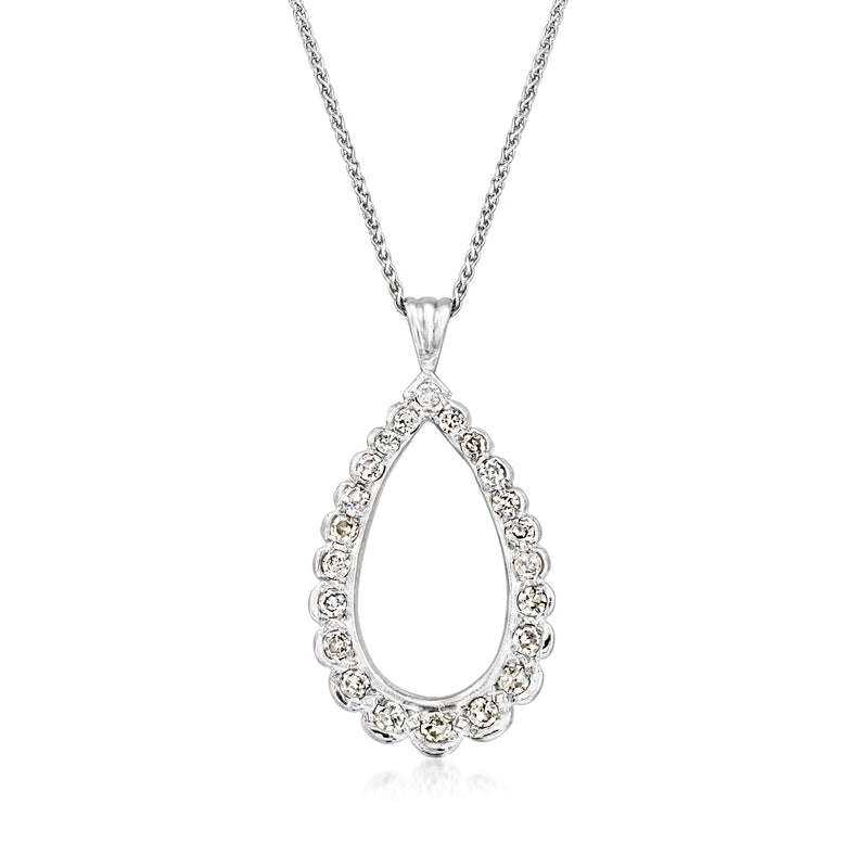 White gold teardrop diamond pendant necklace with stone surround, on chain.