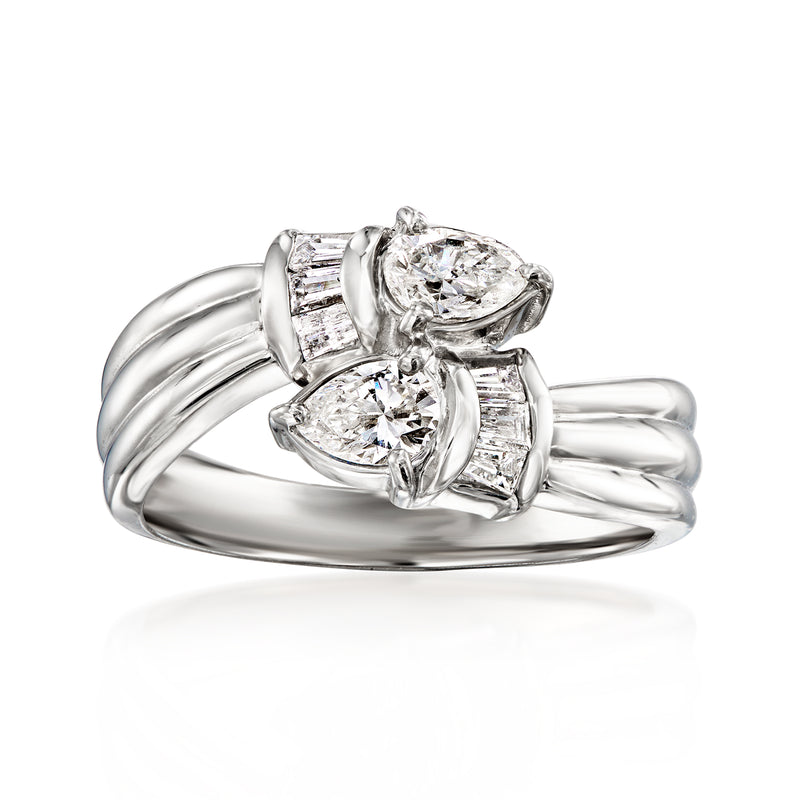 Vintage platinum bypass diamond ring with oval center and two rectangular side stones