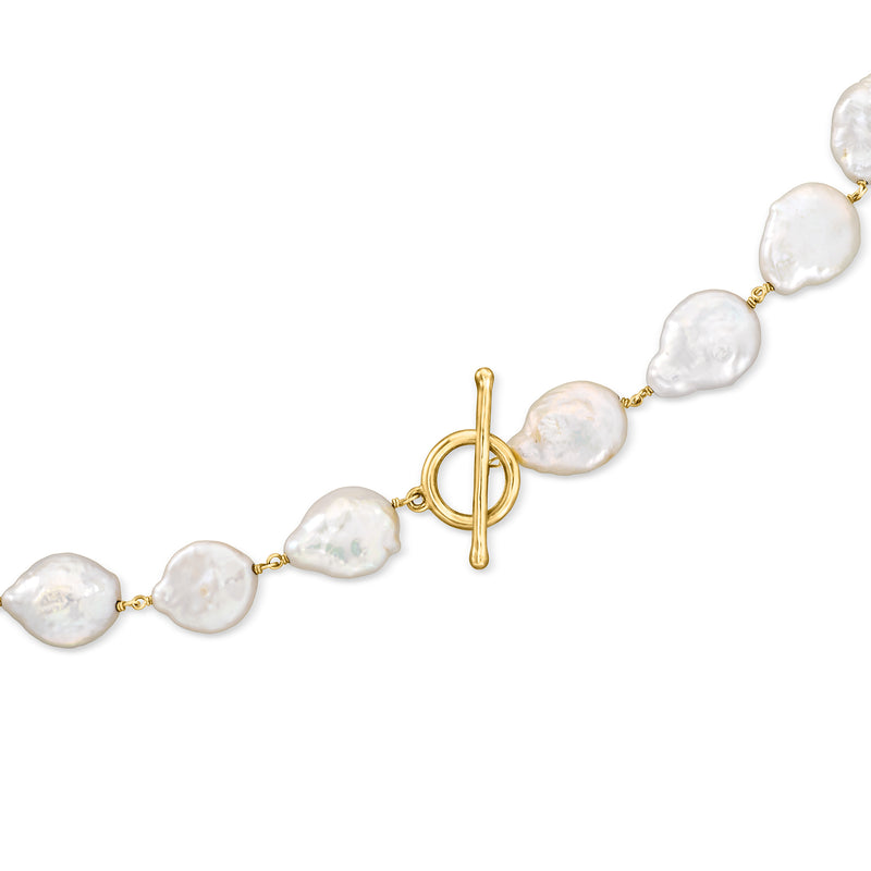 Baroque pearl toggle necklace detail with irregular white pearls and gold-tone toggle clasp