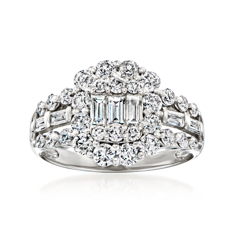 Platinum diamond cluster ring with baguette center and round side stones