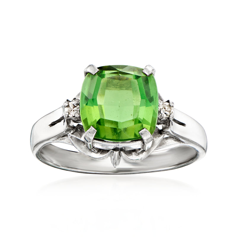 Platinum ring with large green tourmaline center and small diamond side accents