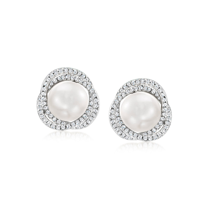 Sterling silver stud earrings with round white pearl and halo of clear stones