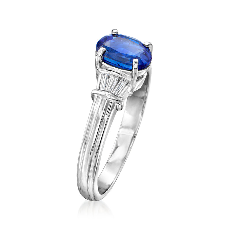 Platinum ring with oval blue sapphire and baguette diamond side settings