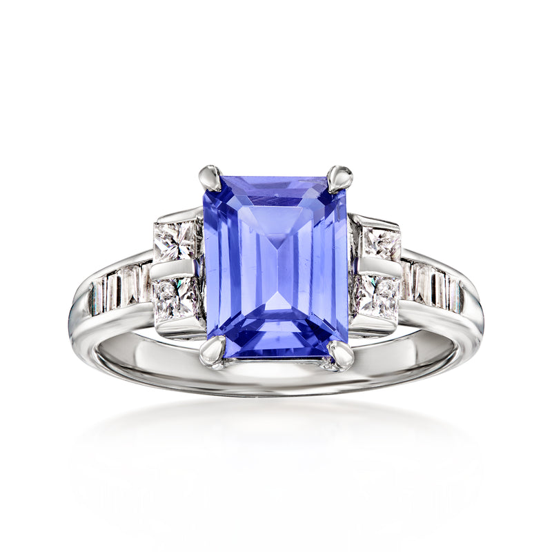 Platinum vintage ring with large rectangular blue tanzanite and diamond side accents