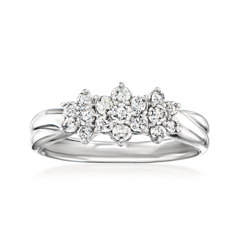 Vintage diamond cluster ring in platinum with round clustered stones on raised band