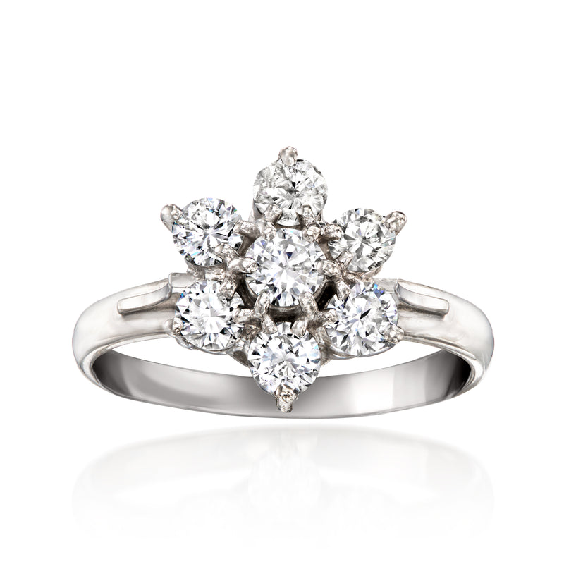 Platinum diamond flower ring with clustered round brilliant stones, openwork band