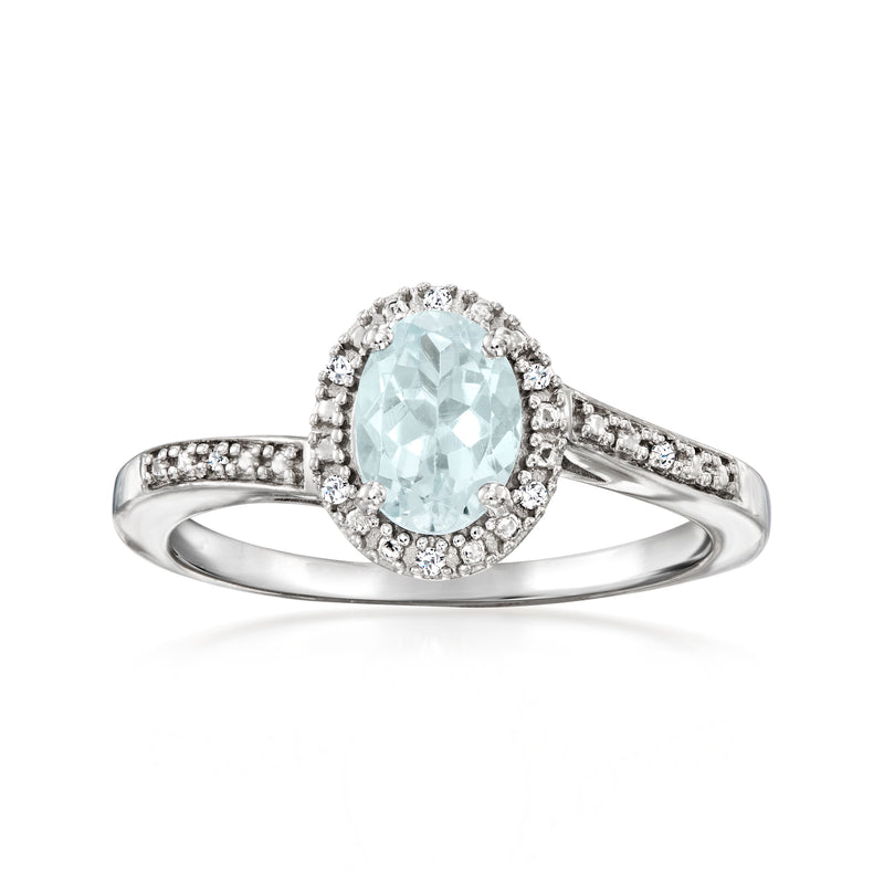 Sterling silver ring with oval light blue aquamarine center and diamond halo