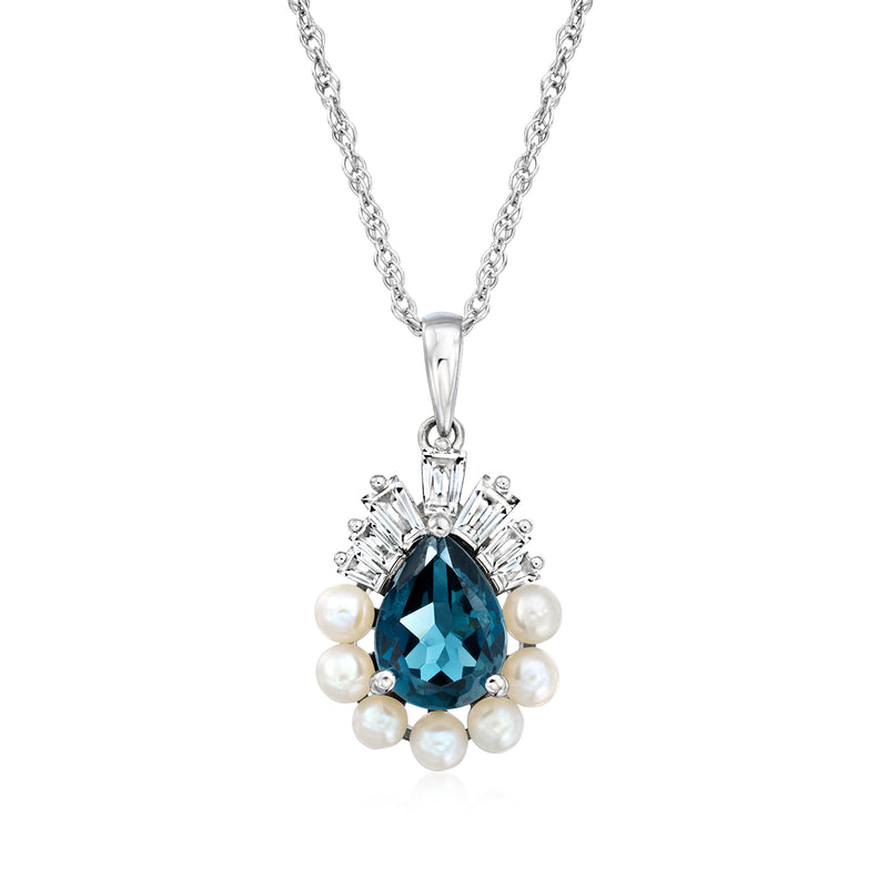 Sterling silver necklace with blue topaz pendant, white stones, pearl accents