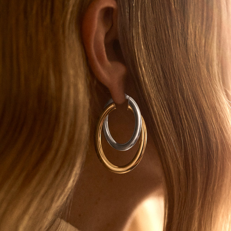 Gold and silver double hoop earrings, glossy rounded hoops in profile