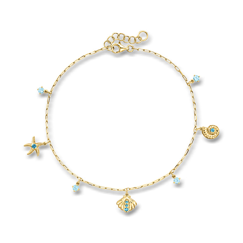 Gold sea life anklet with blue gemstone charms—starfish and shell on a thin chain